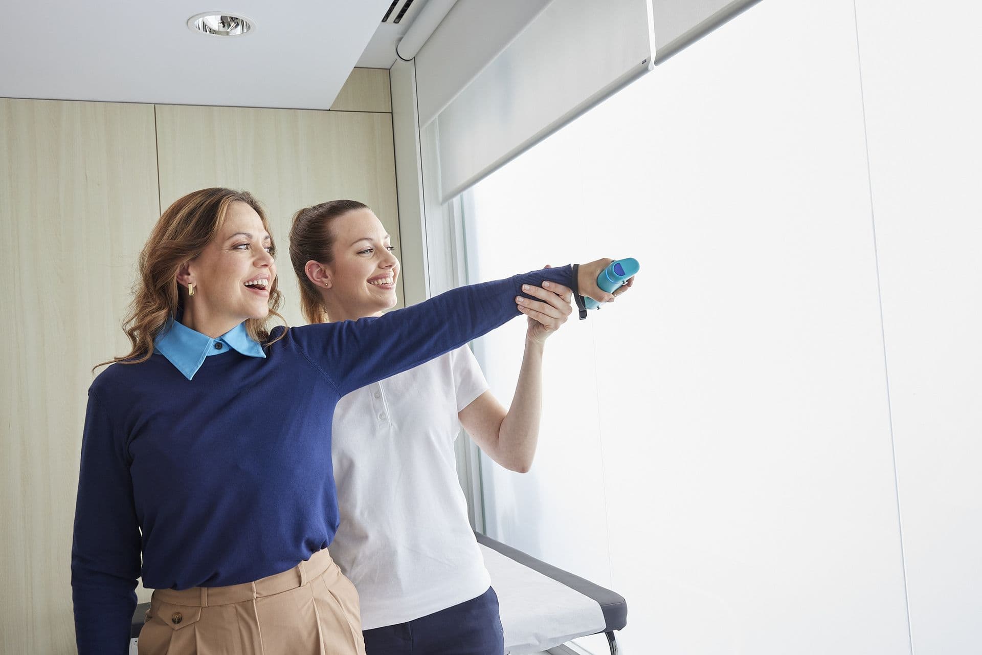 Resident celebrating progress during a wellness session