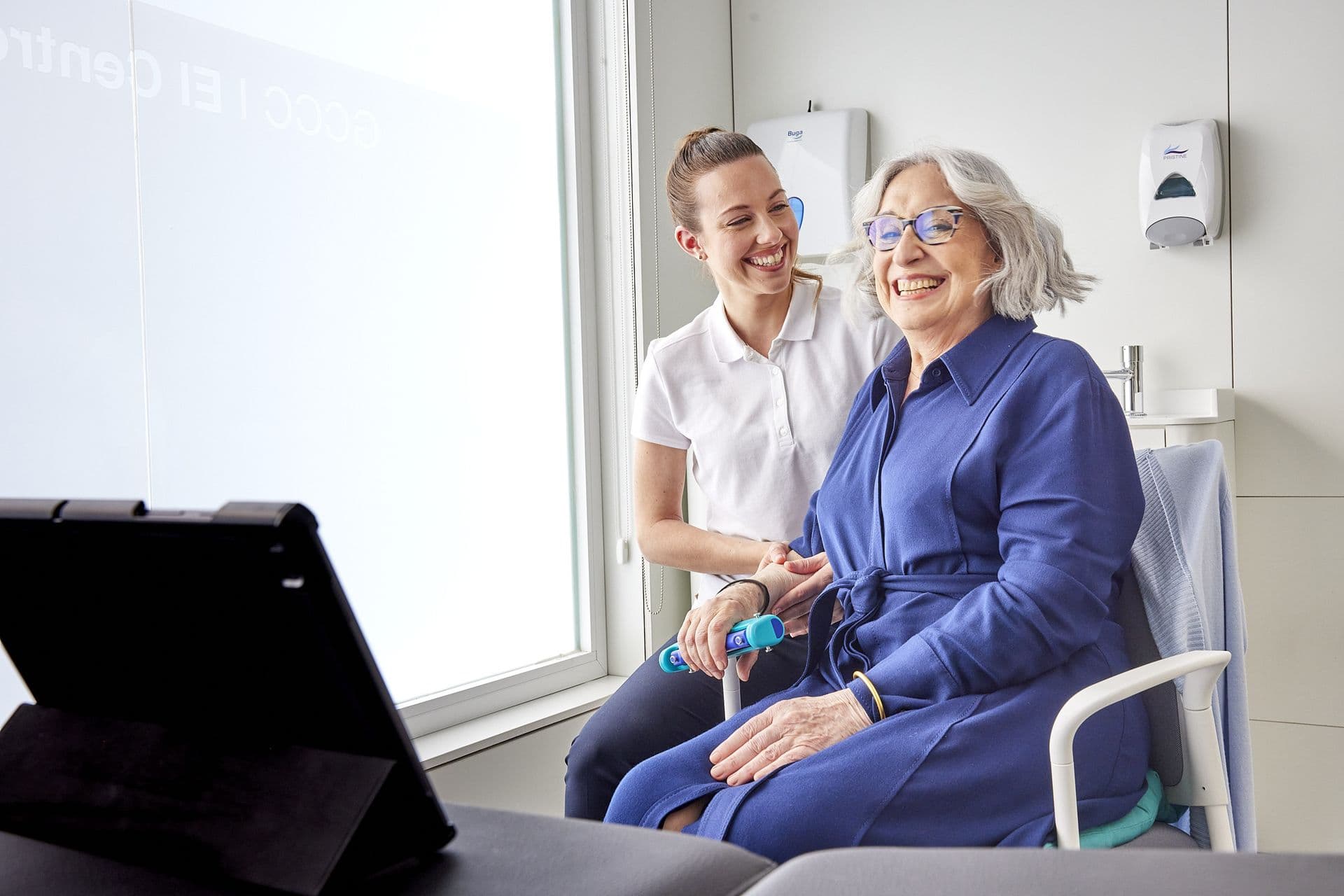 Therapist and patient laughing during a session