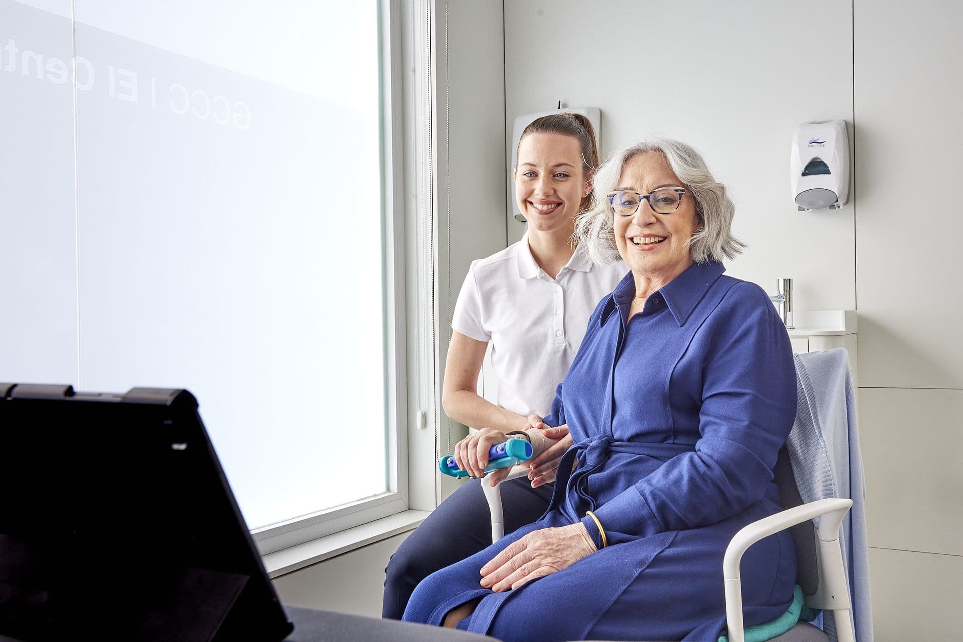 Therapist and patient smiling during an assessment session