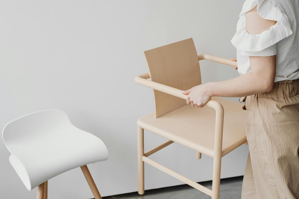 woman moving a chair, chair to stand test